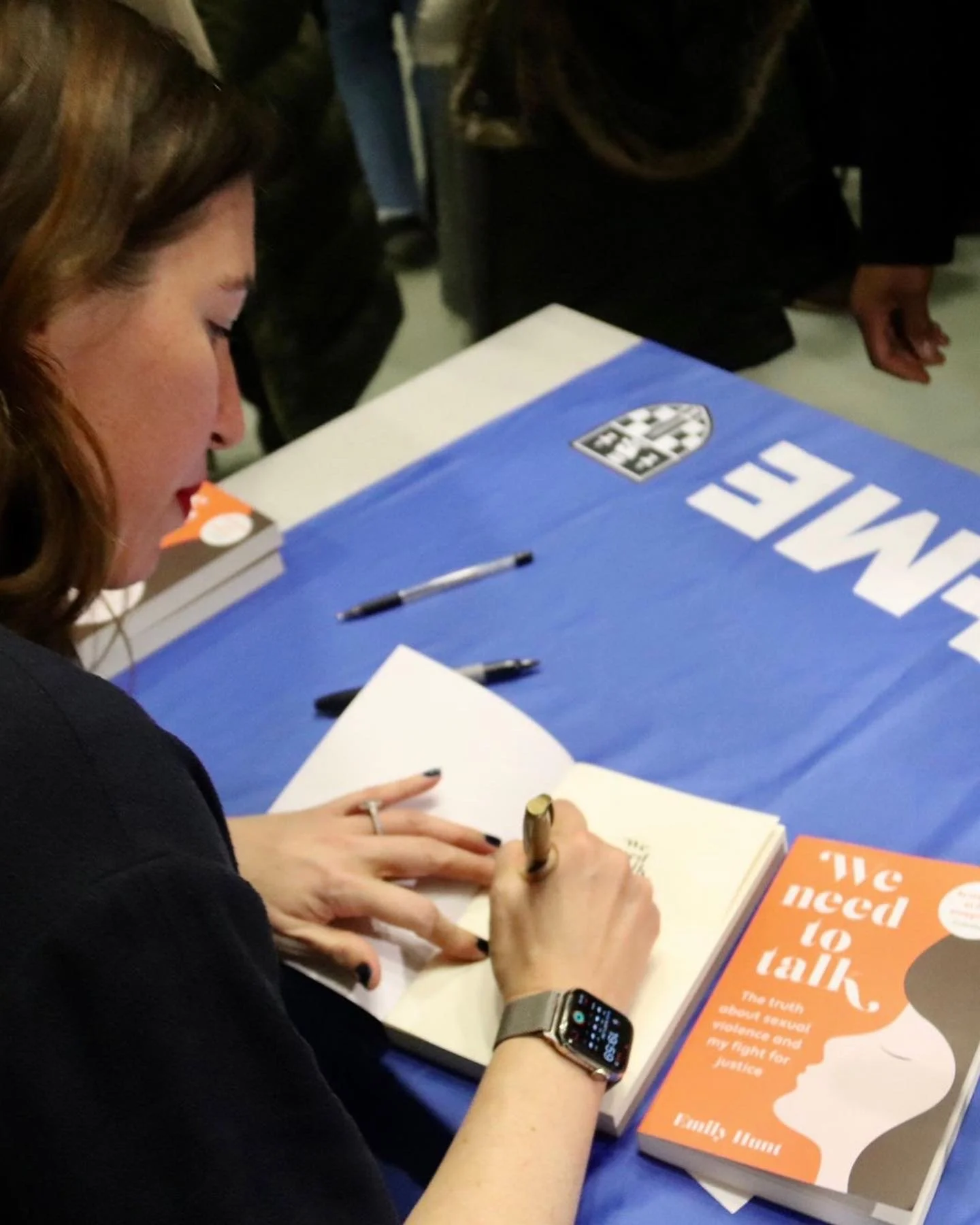 Emily signing copies of We Need to Talk
