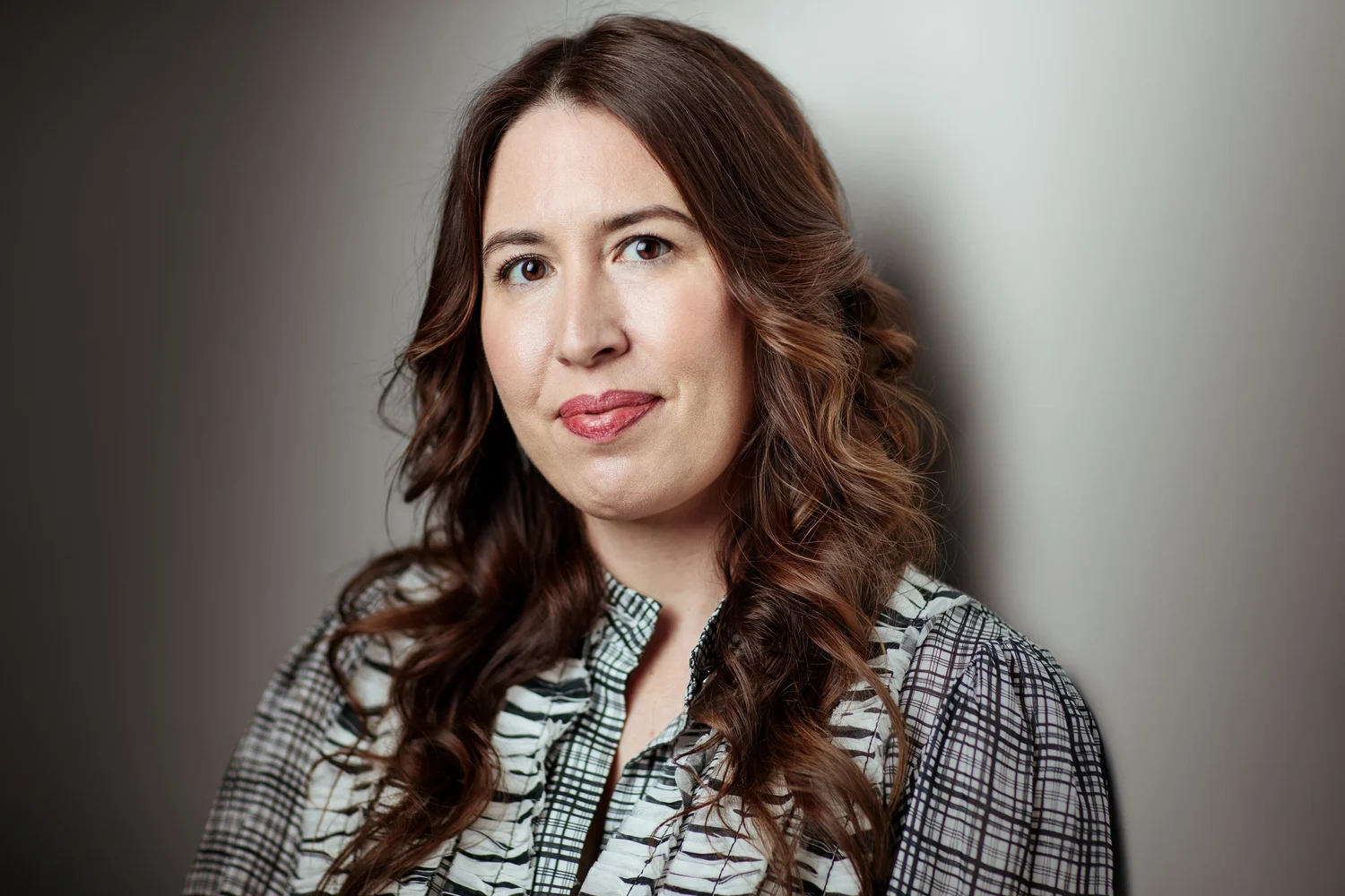 Emily Hunt-Adiletta headshot, checked shirt